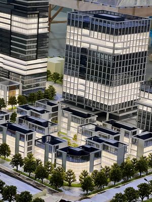 Architectural Model of Modern Urban Complex with Integrated Stadium, Business District and Landscaping